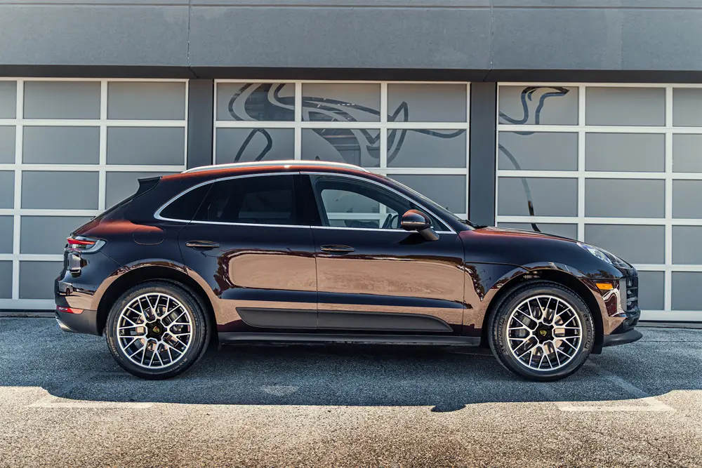 Porsche Macan in front of the shop doors
